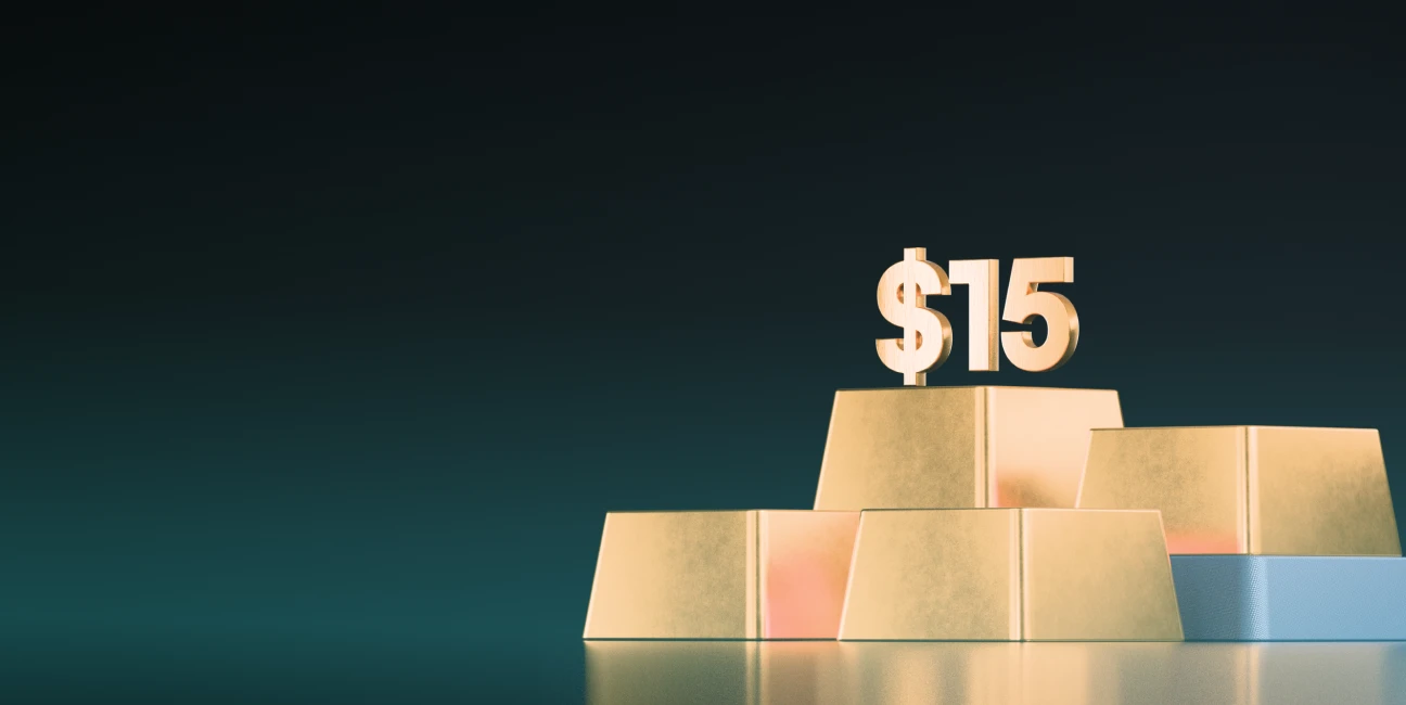 XMTrading unlimited commissions showing $15 payouts symbolised by gold bars and large $15 figure