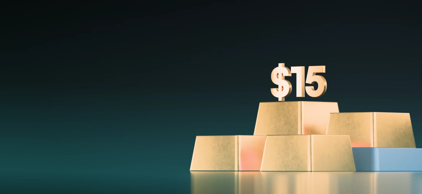 XMTrading unlimited commissions showing $15 payouts symbolised by gold bars and large $15 figure