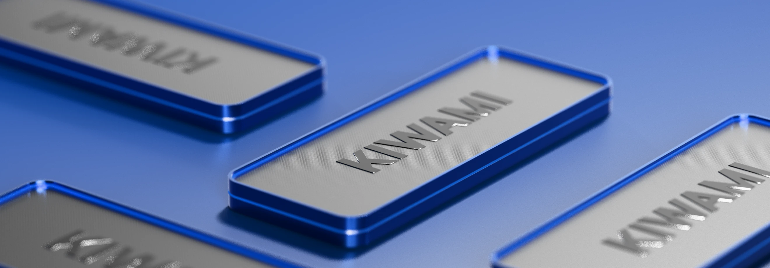Close-up view of metallic nameplates displaying XMTrading account types, with a focus on the ‘KIWAMI’ plate in a sleek silver and blue finish.