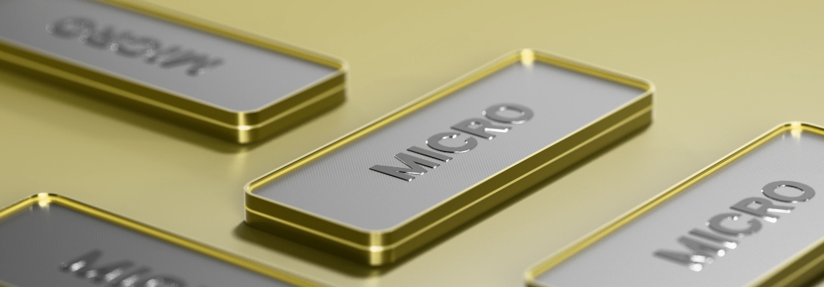 Close-up view of metallic nameplates displaying XMTrading account types, with a focus on the ‘Micro’ plate in a sleek silver and yellow finish.