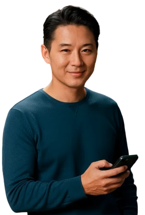 A man smiling while viewing his phone screen displaying trading data and trade positions with positive gains.