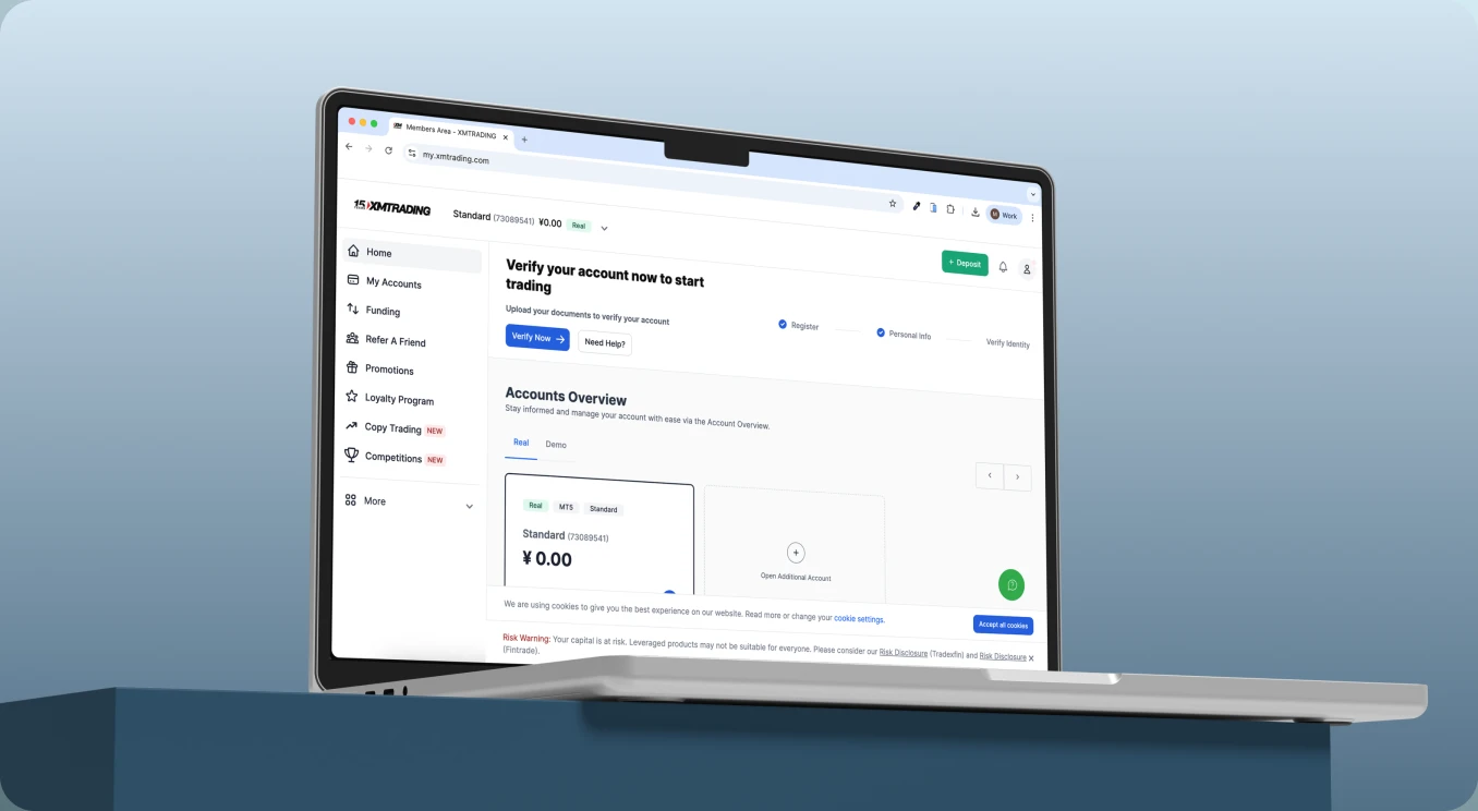 XMTrading Members Area on a laptop showing account dashboard, verification prompt, and accounts overview.