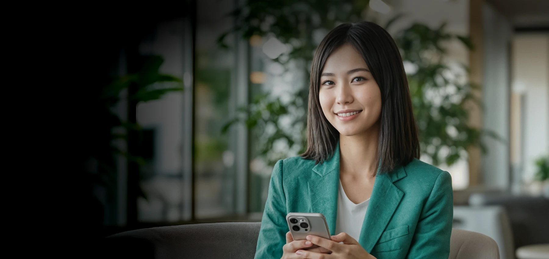 Businesswoman using XMTrading app on her smartphone with live trading metrics showcasing trusted global trading.