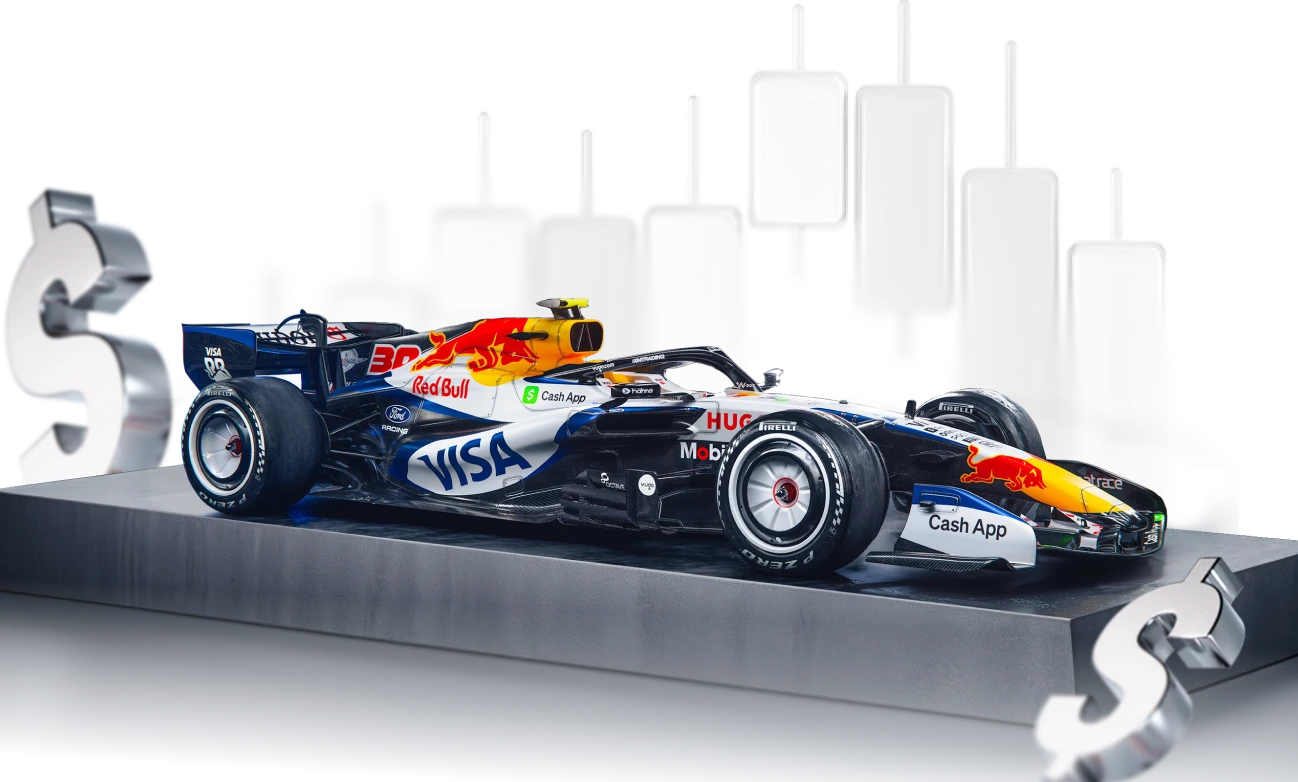 Visa Cash App RB Formula 1 car speeding on the track, representing XMTrading’s sponsorship partnership.