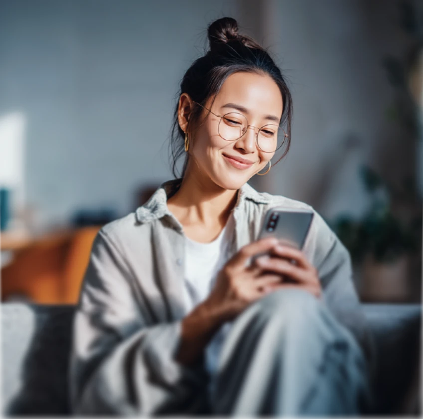 User completing the account registration process on a smartphone with the XMTrading sign-up form displayed.