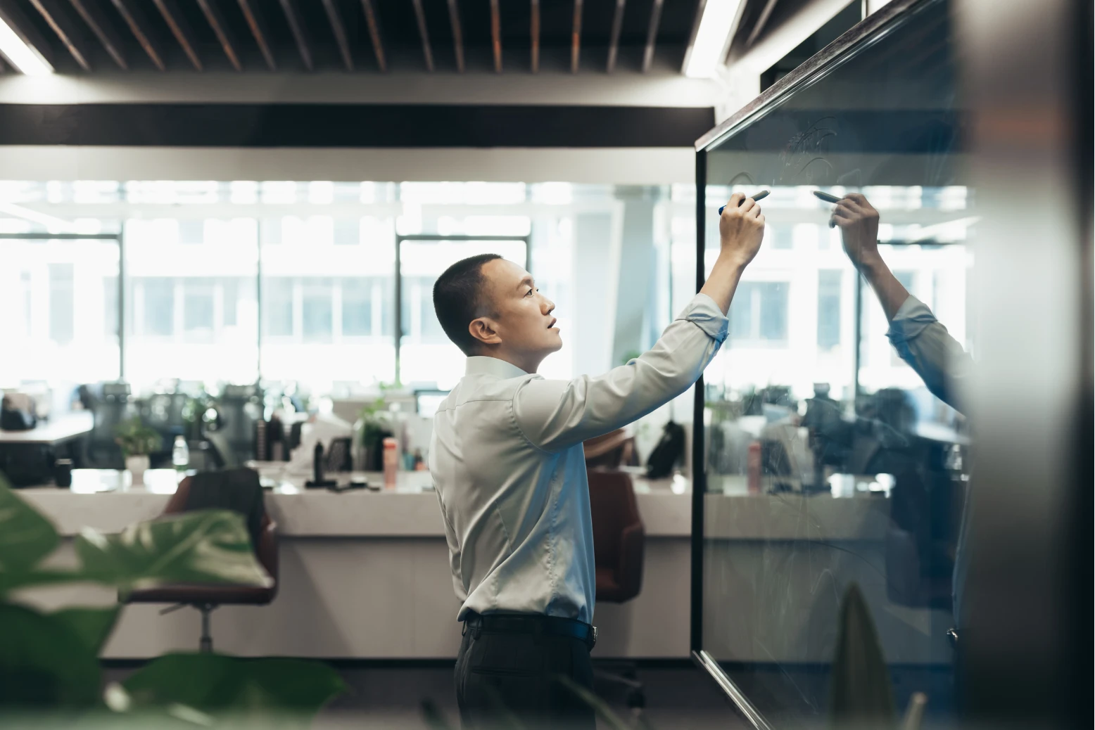 Collaborative office scenes showing diverse teams brainstorming, presenting, and working together in a modern, creative workspace.