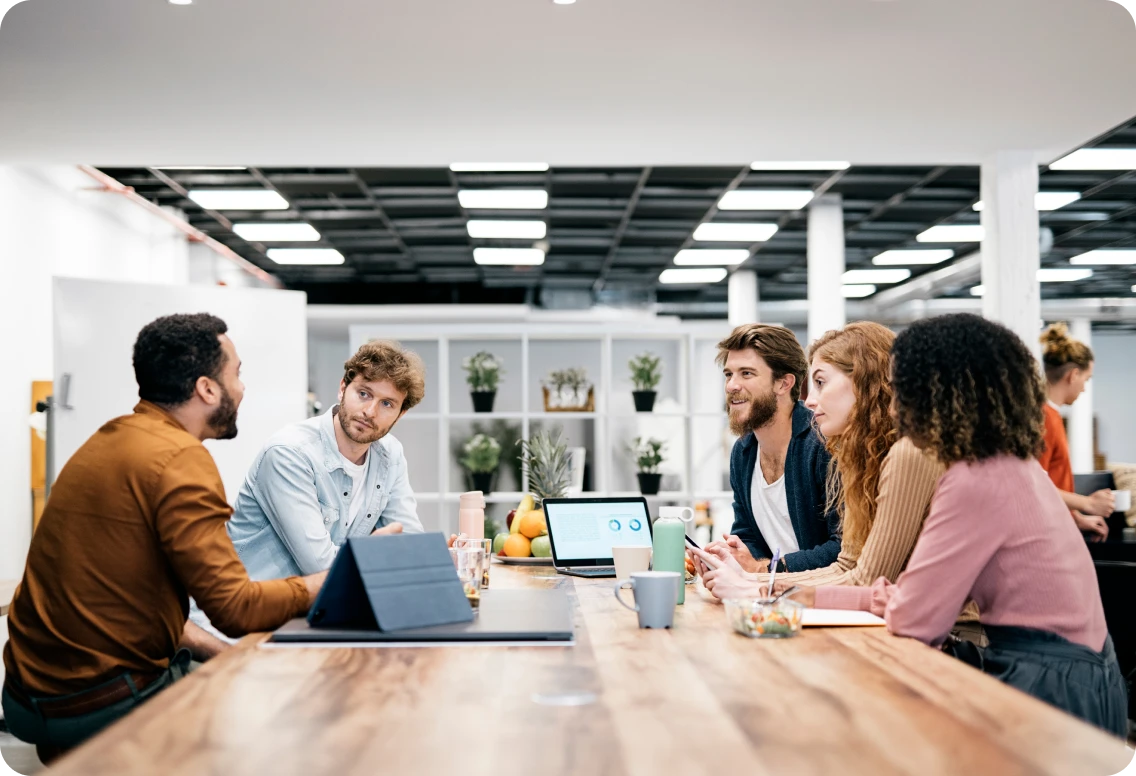 Collaborative office scenes showing diverse teams brainstorming, presenting, and working together in a modern, creative workspace.
