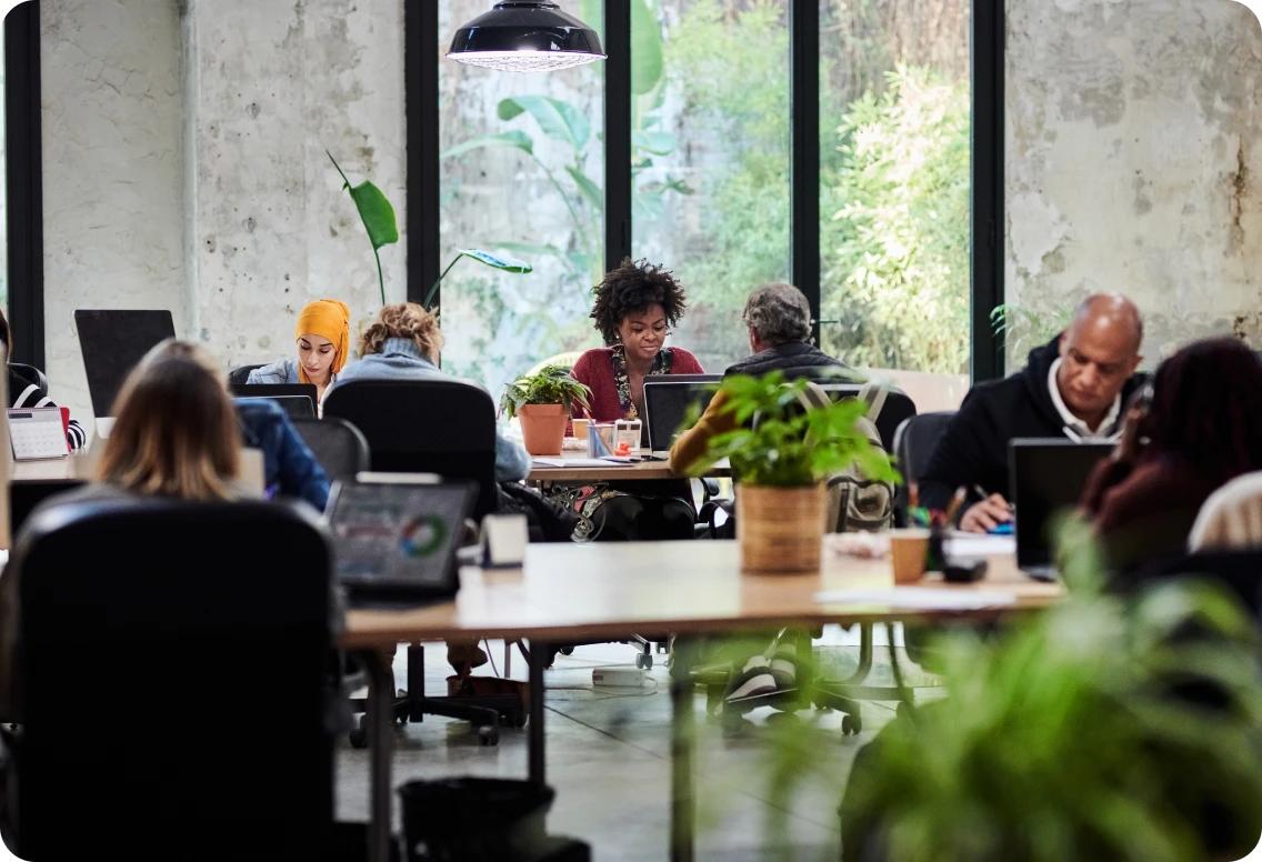 Collaborative office scenes showing diverse teams brainstorming, presenting, and working together in a modern, creative workspace.