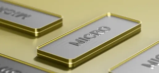 Close-up of the Micro account card in a premium metallic 3D design, highlighted with gold accents.